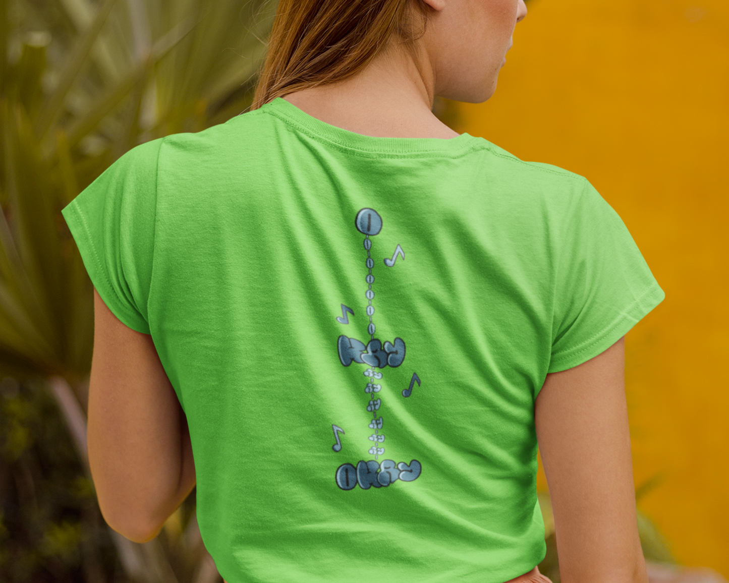 Back image of model wearing Green t-shirt dress for women