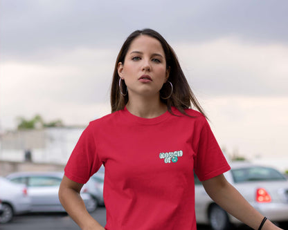 Front image of model wearing red t-shirt dress for women.