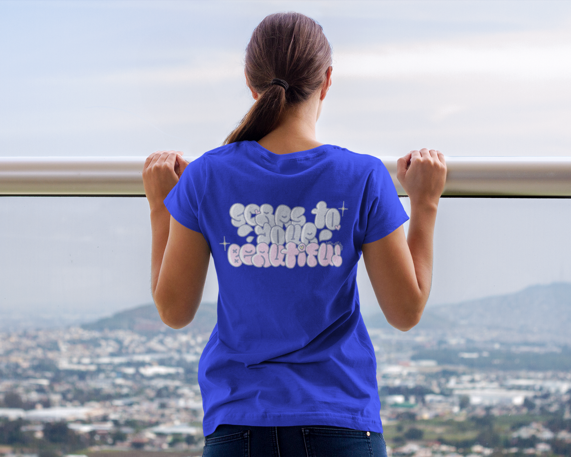 Back image of model wearing Blue t-shirt dress for women