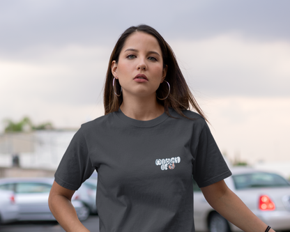 Front image of model wearing black t-shirt dress for women.